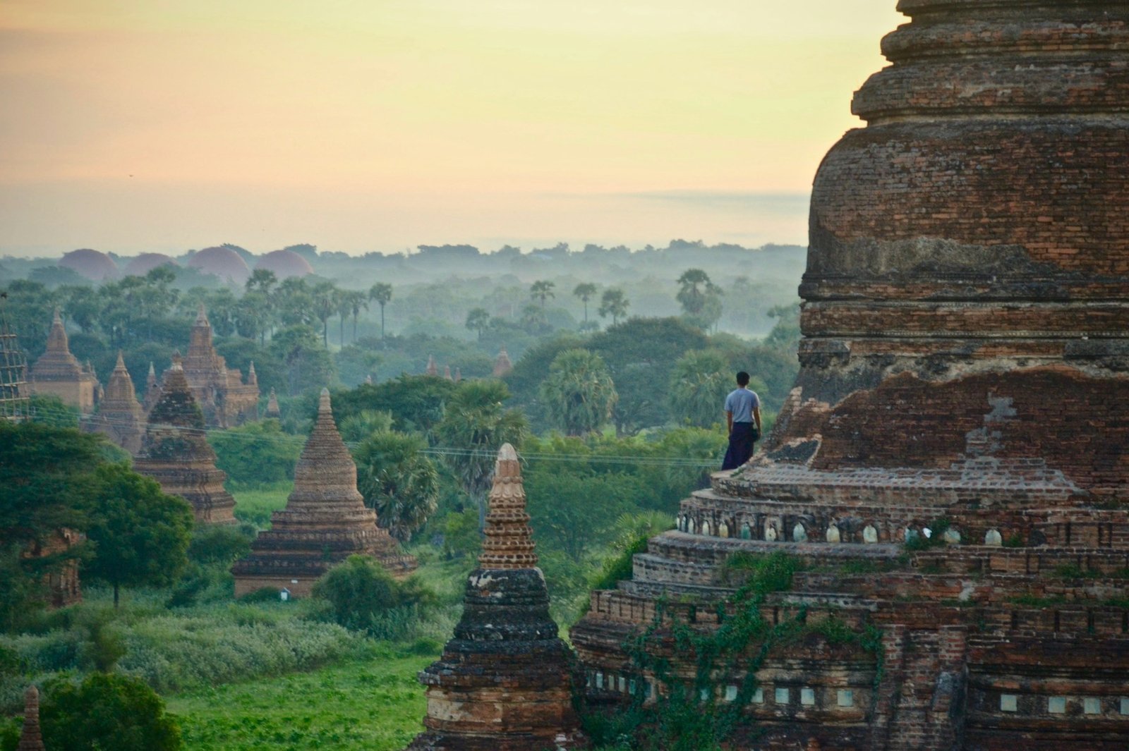 Watching sunrise over the temples of Bagan as hot air balloons rise into the sky