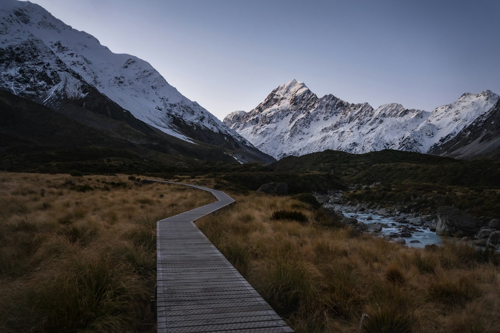 A boardwalk trail through New Zealand's Southern Alps on the Hooker Valley Track near Mount Cook - the same kind of alpine hiking scenery found on Mount Te Aroha's trail network